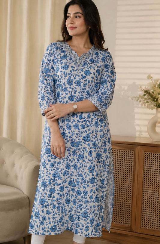 White dress with blue floral print.